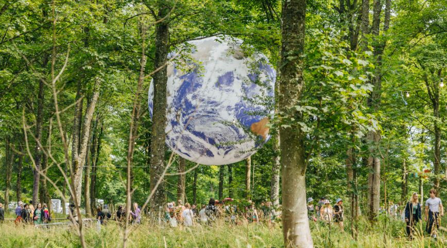 A globe in a forest 